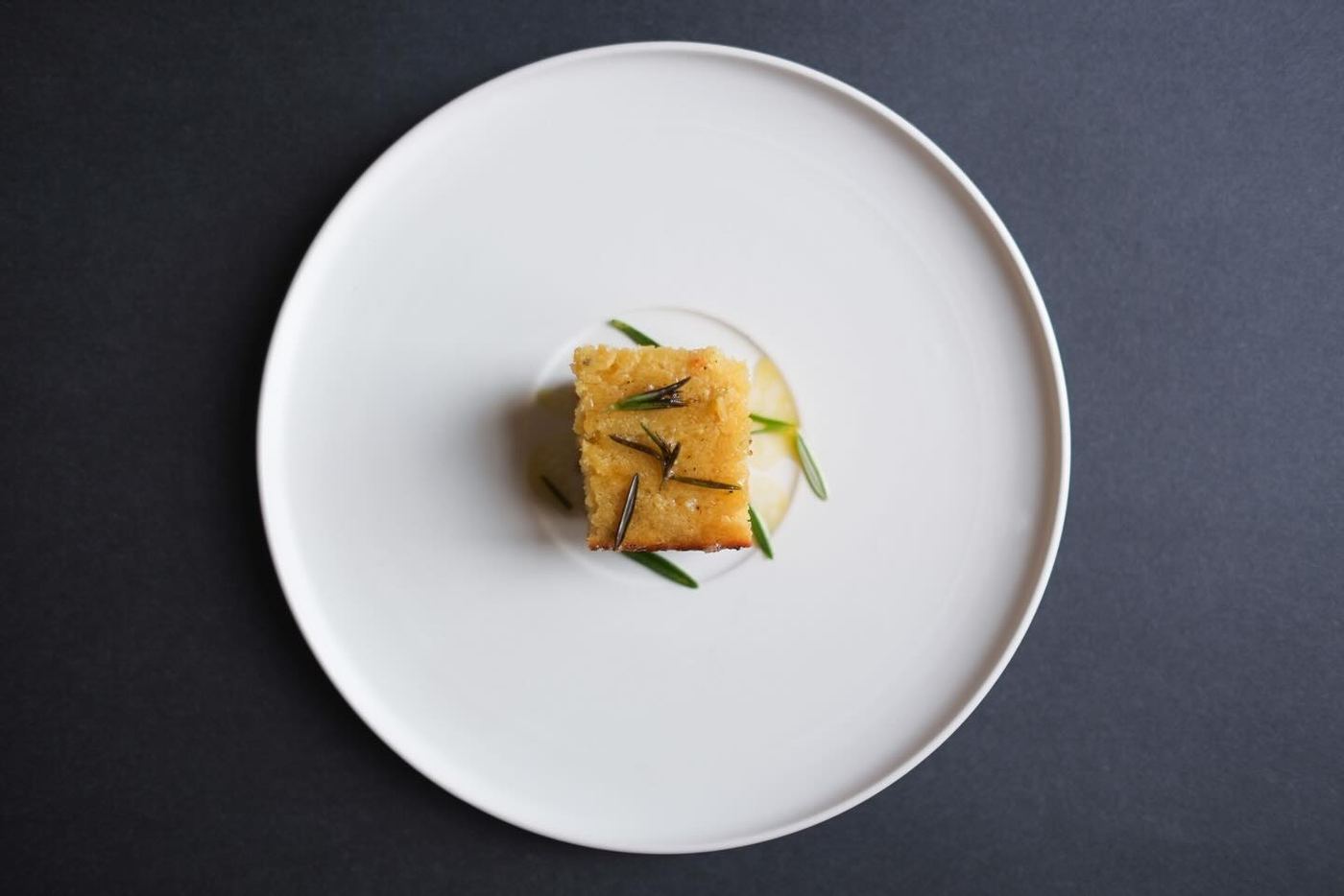 Cornbread served on a white ceramic plate