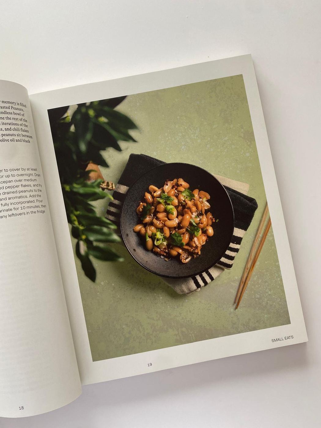 First Generation open to pages 18 and 19, featuring a dish served in Christian Palino tableware