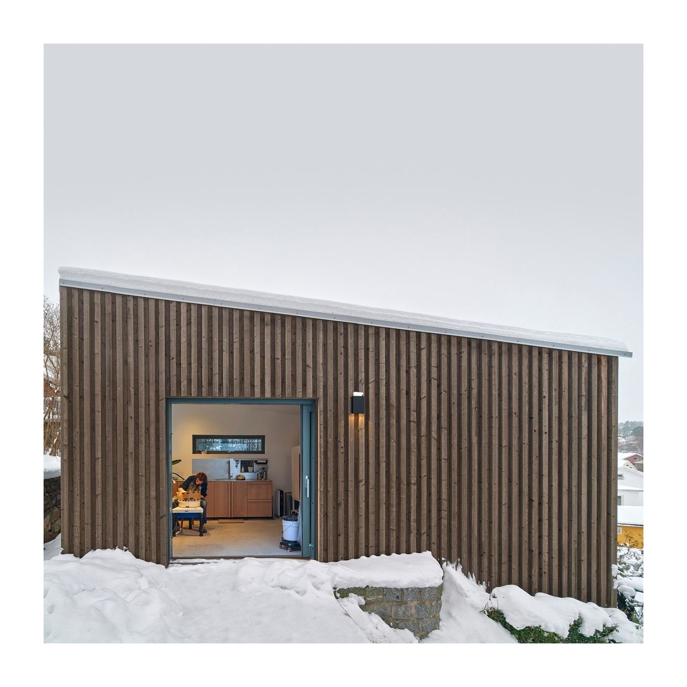 Christian Palino working at the wheel inside his snow-covered Edsviken studio